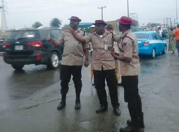 Mr. Imoh Etuk (middle) and two other FRSC officials