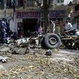 Somali soldiers and explosion experts assess the wreckage of a car destroyed in a bomb explosion at a local government headquarters that killed five people in Somalia's capital Mogadishu, April 11, 2016. REUTERS/Ismail Taxta