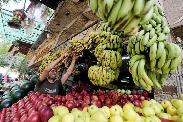 An Egyptian fruits seller is seen at a market in Cairo, Egypt May 10, 2016.