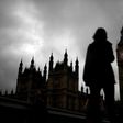 A woman walks past the Houses of Parliament and the Big Ben clock tower, on the day of the EU referendum, in central London, Britain June 23, 2016.