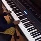 Olamide teaches son how to play the Piano