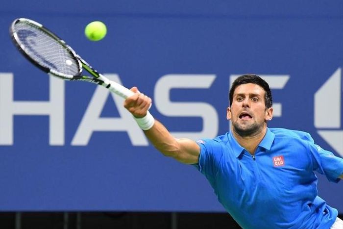 Novak Djokovic of Serbia hits to Jerzy Janowicz of Poland on day one of the 2016 U.S. Open tennis tournament at USTA Billie Jean King National Tennis Center.