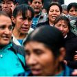 Relatives of 71 people massacred in 1985 by a military patrol in the Andean city of Accomarca, chant slogans asking for justice, outside a court in Lima, Peru, Wednesday, Aug. 31, 2016.