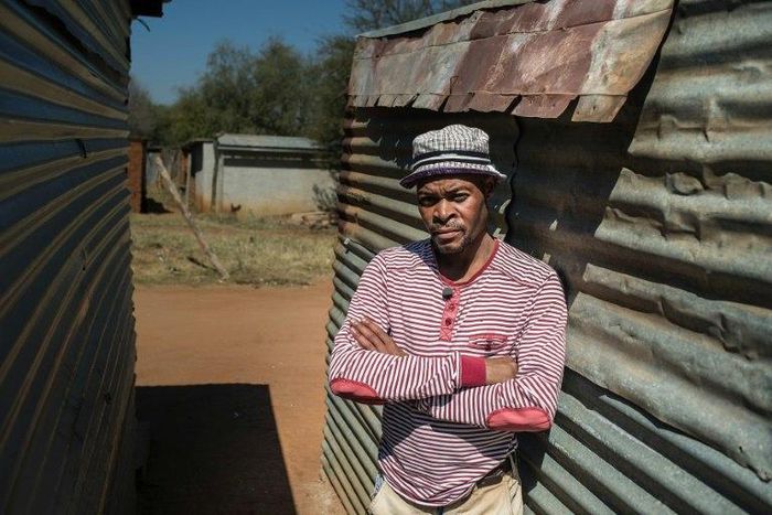 Mohlaudi Mohlaudi stands outside his house in Marikana, where in 2012 police opened fire on striking platinum workers, killing 34 miners and wounding dozens more 