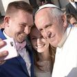 Pope Francis with a newly married couple