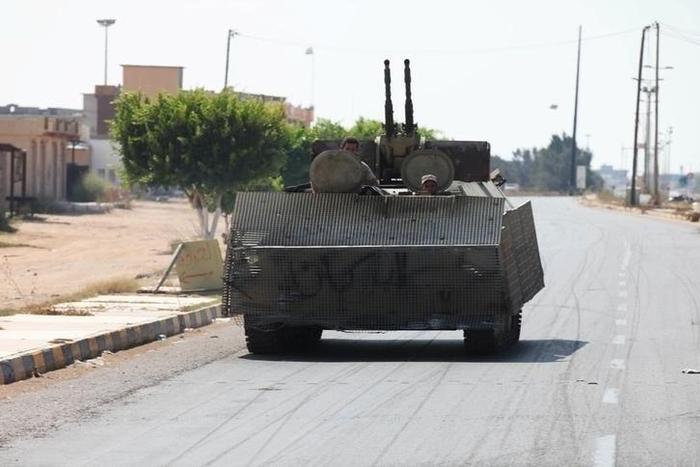 Libyan forces allied with the U.N.-backed government ride in their carrier during a battle with Islamic State militants in neighborhood Number Three in Sirte, Libya, September 4, 2016.