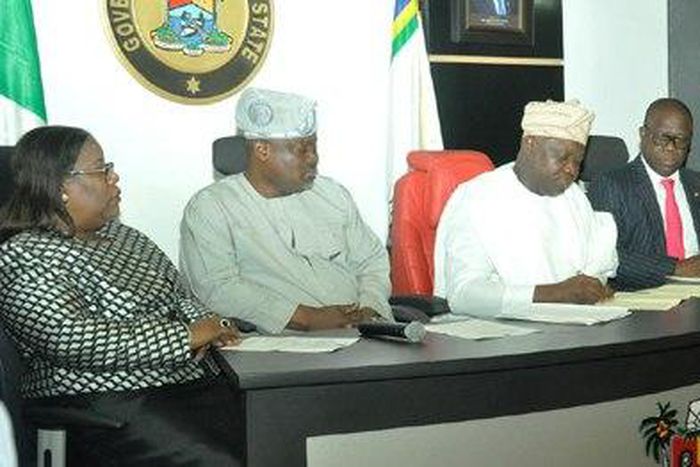 Lagos State Governor, Mr. Akinwunmi Ambode (2nd right), signing the Property Protection and Neighbourhood Safety Agency Laws.