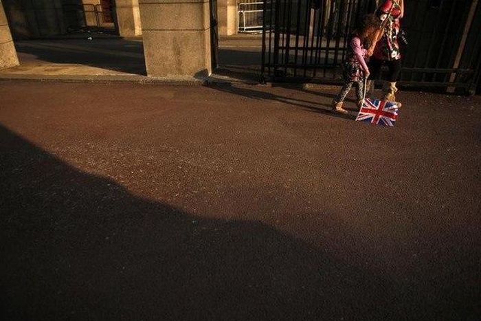 A girl holds a British flag on the day that Kate Middleton married Britain's Prince William in Westminster Abbey, in central London April 29, 2011.
