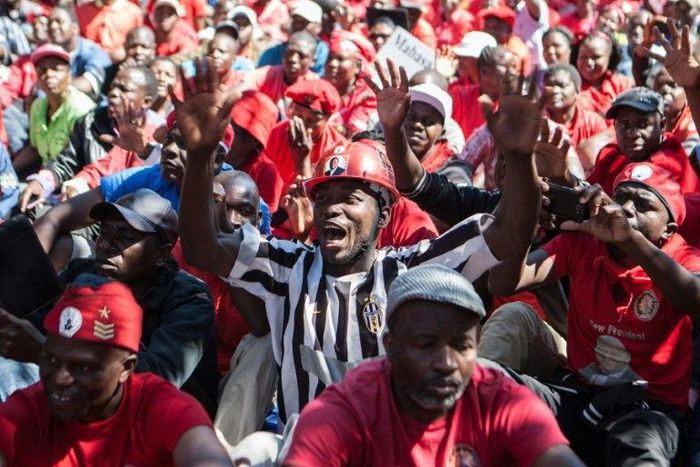 Zimbabwe's opposition party supporters shout anti-government slogans during a demonstration in Gweru, on August 13, 2016 