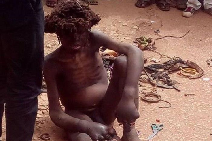 The mad man receiving his healing through prayers