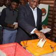 United Party for National Development (UPND) President candidate Hakainde Hichilema (R) and his son Habwela Hakainde cast their votes during the presidential and parliamentary elections in the capital, Lusaka, Zambia, August 11, 2016.