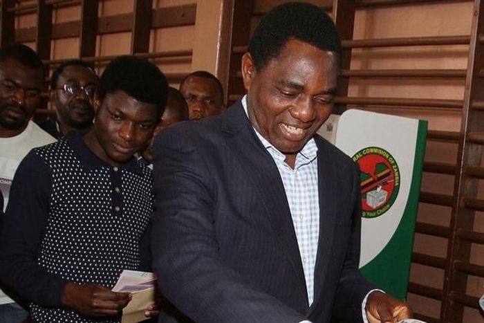 United Party for National Development (UPND) President candidate Hakainde Hichilema (R) and his son Habwela Hakainde cast their votes during the presidential and parliamentary elections in the capital, Lusaka, Zambia, August 11, 2016.