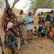 Nigerian refugees, who fled from their village into Niger following Boko Haram attacks, stand in the yard of their Nigerien host in Diffa in southeastern Niger June 21, 2016.