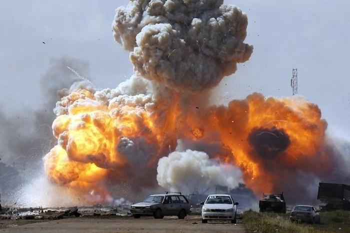 Vehicles belonging to forces loyal to Libyan leader Muammar Gaddafi explode after an air strike by coalition forces, along a road between Benghazi and Ajdabiyah March 20, 2011.