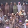 A still image from a video posted by Nigerian Islamist militant group Boko Haram on social media, seen by Reuters on August 14, 2016, shows a masked man talking to dozens of girls the group said are school girls kidnapped in the town of Chibok in 2014....