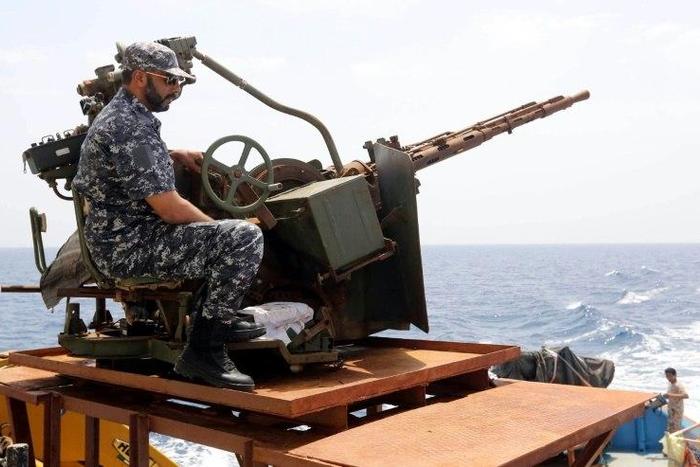 A member of the Libyan coastguards mans a machine gun on a patrol boat off the coast of Misrata on May 9, 2015