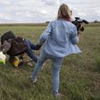 Hungary charges camerawoman accused of tripping fleeing migrants