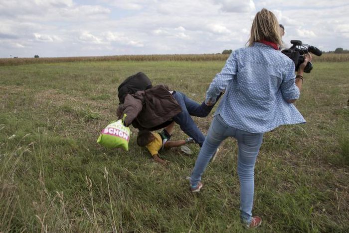 Hungary charges camerawoman accused of tripping fleeing migrants