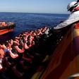 Migrants are seen before embark on Migrant Offshore Aid Station (MOAS) rescue vessel Phoenix during a rescue operations in the international waters between Malta and Libya on August 10,2016.