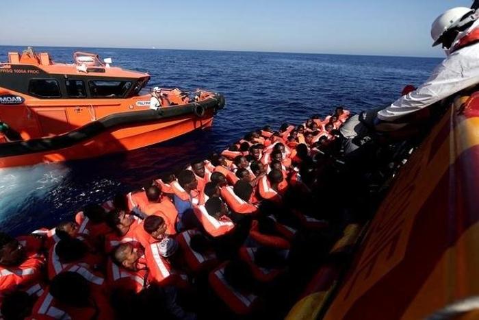 Migrants are seen before embark on Migrant Offshore Aid Station (MOAS) rescue vessel Phoenix during a rescue operations in the international waters between Malta and Libya on August 10,2016.
