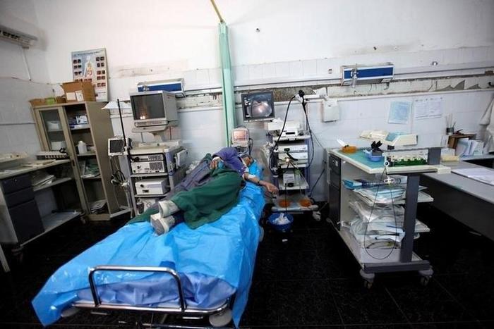 A patient lies on a bed as she receives treatment at Tripoli Central Hospital in Tripoli, Libya July 18, 2016. Picture taken July 18, 2016.