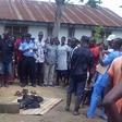 The angry mob with the charred remains of the mother-in-law