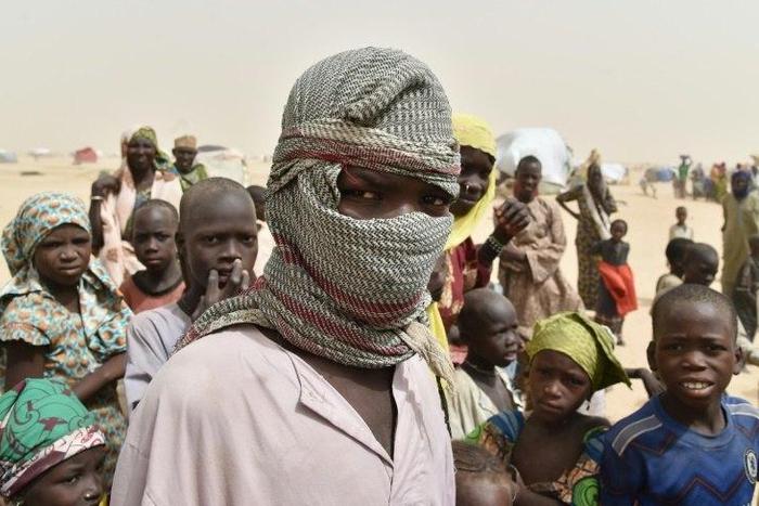 A boy looks on in a camp in the village of Kidjendi near Diffa on June 19, 2016 as displaced families fled from Boko Haram attacks in Bosso