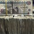 Egypt's pound notes are pictured in stacks of 100 as employees count money at an exchange office in downtown Cairo in a file photo. REUTERS/Amr Abdallah Dalsh