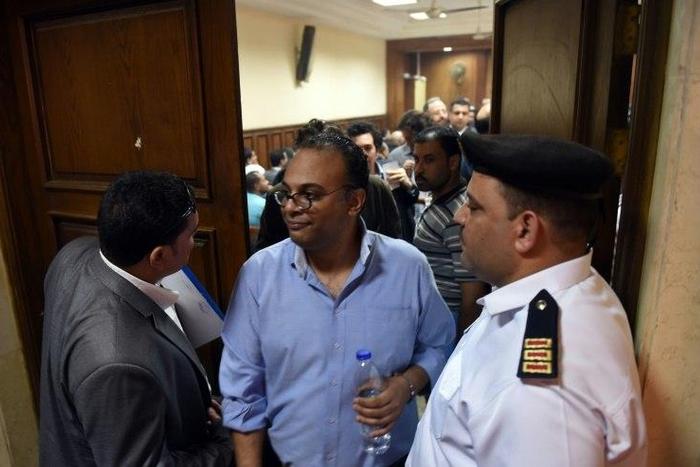 Renowned human rights activist Hossam Bahgat (C), seen here leaving a courtroom in Cairo in April, is one of five whose assets have been seized following a lengthy legal process