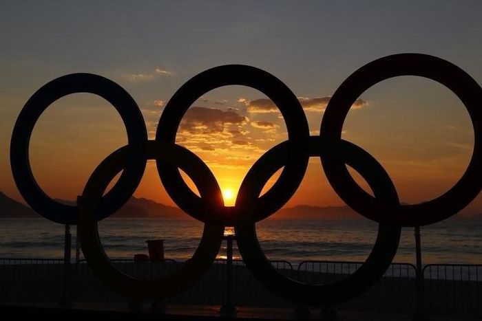 2016 Rio Olympics - Cycling Road - Final - Men's Road Race - Fort Copacabana - Rio de Janeiro, Brazil - 06/08/2016. The Olympic rings are seen as the sun rises over Fort Copacabana ahead of the Men's Road Race.
