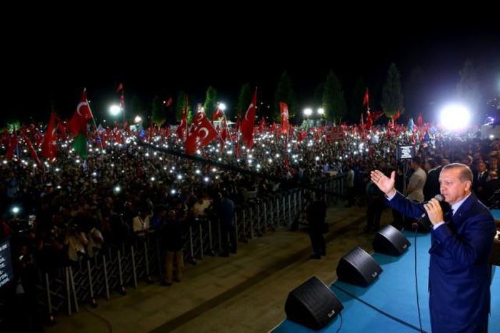 Turkey's President Tayyip Erdogan addresses his supporters in front of the Presidential Palace in Ankara, Turkey, August 10, 2016.