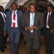 Kenyan President Uhuru Kenyatta is escorted from the meeting hall during the Intergovernmental Authority on Development (IGAD) extraordinary summit on South Sudan in Ethiopia's capital Addis Ababa, August 5, 2016.