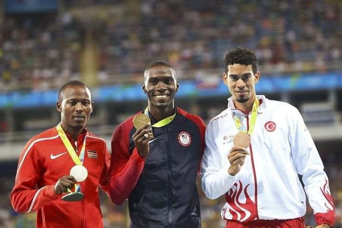 Gold medalist Kerron Clement (USA) of USA, silver medalist Boniface Mucheru (KEN) of Kenya and bronze medalist Yasmani Copello (TUR) of Turkey pose. 2016 Rio Olympics - Athletics - Victory Ceremony - Men's 400m Hurdles Victory Ceremony - Olympic Stadiu...