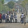 A protester opposed to the Burundi President Pierre Nkurunziza's third term is snatched by members of the 'Imbonerakure', the youth wing of the ruling party, in Bujumbura on May 25, 2015