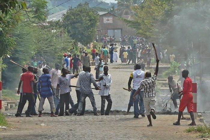 A protester opposed to the Burundi President Pierre Nkurunziza's third term is snatched by members of the 'Imbonerakure', the youth wing of the ruling party, in Bujumbura on May 25, 2015