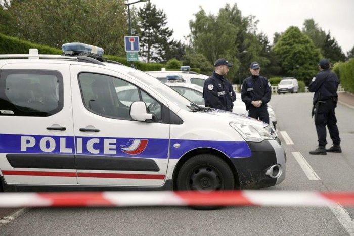Police cordon off a street in Magnanville, northern France after a man claiming allegiance to the Islamic State group killed two people on June 13, 2016 