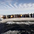 Migrants, who tried to flee to Europe, travel in a dinghy after they were stopped by Libyan coast guards and made to head to Tripoli September 29, 2015.