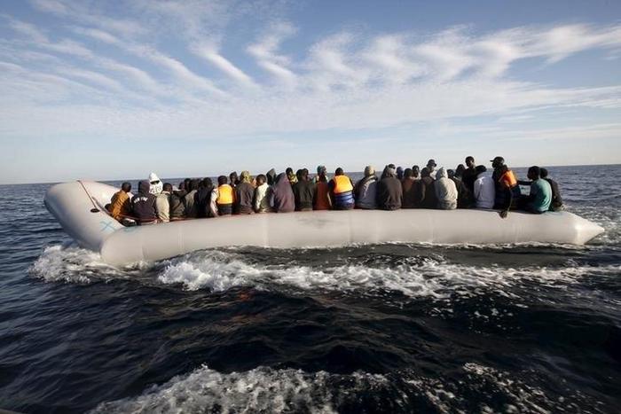Migrants, who tried to flee to Europe, travel in a dinghy after they were stopped by Libyan coast guards and made to head to Tripoli September 29, 2015.