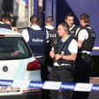 Belgian police secure the area around a police station in Charleroi following a machete attack on two policewomen on August 6, 2016 