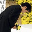 apan's Prime Minister Shinzo Abe bows as he offers a chrysanthemum flower to the war dead during a memorial service ceremony marking the anniversary of Japan's surrender in World War Two at Budokan Hall in Tokyo, Japan, in this photo taken by Kyodo Aug...