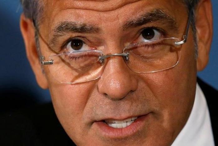 Actor and The Sentry co-founder George Clooney appears on a panel with The Sentry investigators to discuss their work on the role of national corruption in the ongoing humanitarian crisis in South Sudan during a news conference at the National Press Cl...