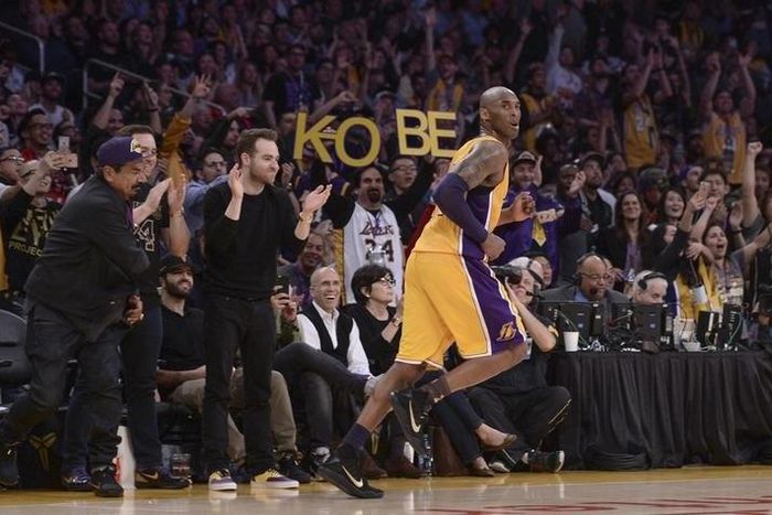 Fans cheer after Los Angeles Lakers forward Kobe Bryant (24) hits a jump shot during the third quarter against the Utah Jazz at Staples Center. Bryant was playing in the final game of his NBA career. Mandatory Credit: Robert Hanashiro-USA TODAY Sports