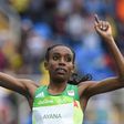 Ethiopia's Almaz Ayana celebrates as she crosses the finish line to win the women's 10,000m during the 2016 Olympic Games in Rio de Janeiro 