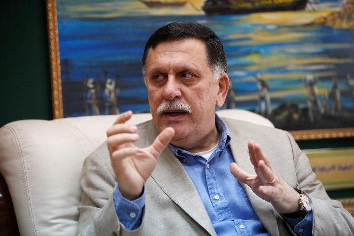 Prime Minister of Libya's unity government Fayez Seraj speaks during an interview with Reuters at his office in the naval base of Tripoli, Libya, June 3, 2016.