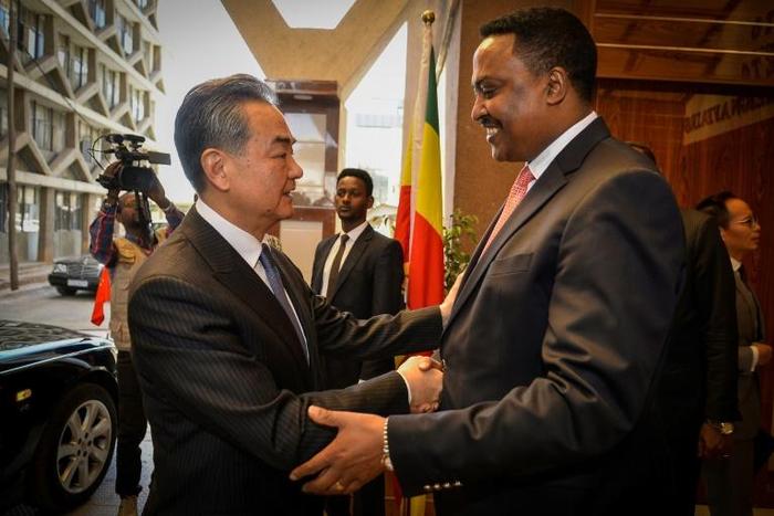 Ethiopian Foreign Minister Workneh Gebeyehu greets his Chinese counterpart Wang Yi as he arrived in Addis Ababa at the start of a four-nation Africa tour
