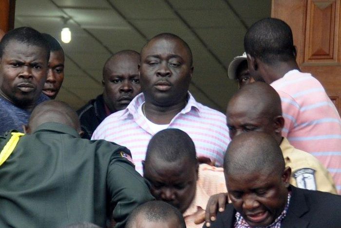 Liberia's parliamentary speaker Alex Tyler (C) leaves the Justice Court on May 25, 2016 in Monrovia 