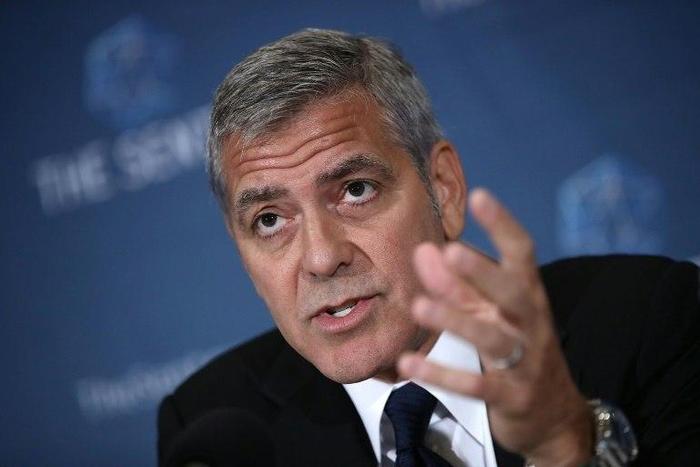 Actor George Clooney answers questions during a press conference about corruption in South Sudan at the National Press Club on September 12, 2016 in Washington, DC