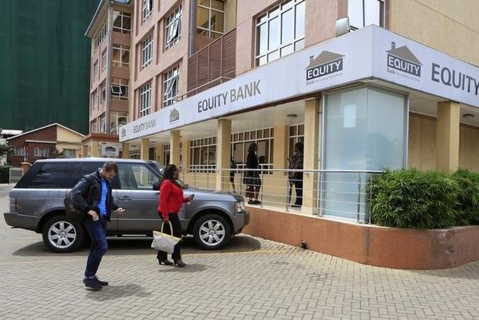Customers arrive at a branch of the Equity Bank for money transactions in Kenya's capital Nairobi November 11, 2015.