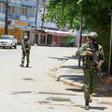 Armed policemen walk outside the central police station after an attack, in the coastal city of Mombasa, Kenya, September 11, 2016.