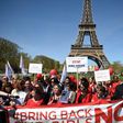 "Bring Back Our Girls" campaigners rally in front of the Eiffel Tower in Paris in April 2014 